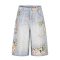 Gradient washed distressed denim shorts